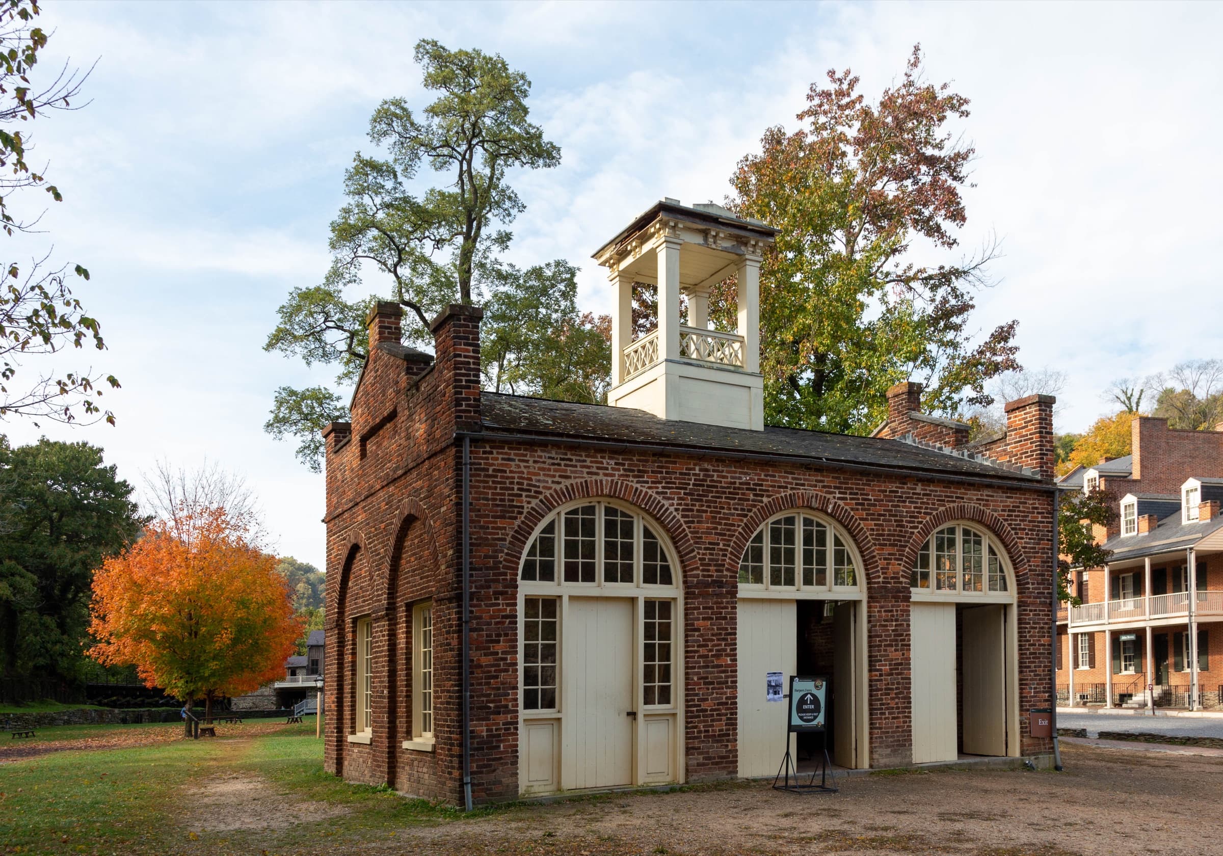 John Brown's Fort in Harpers Ferry beneath autumn leaves