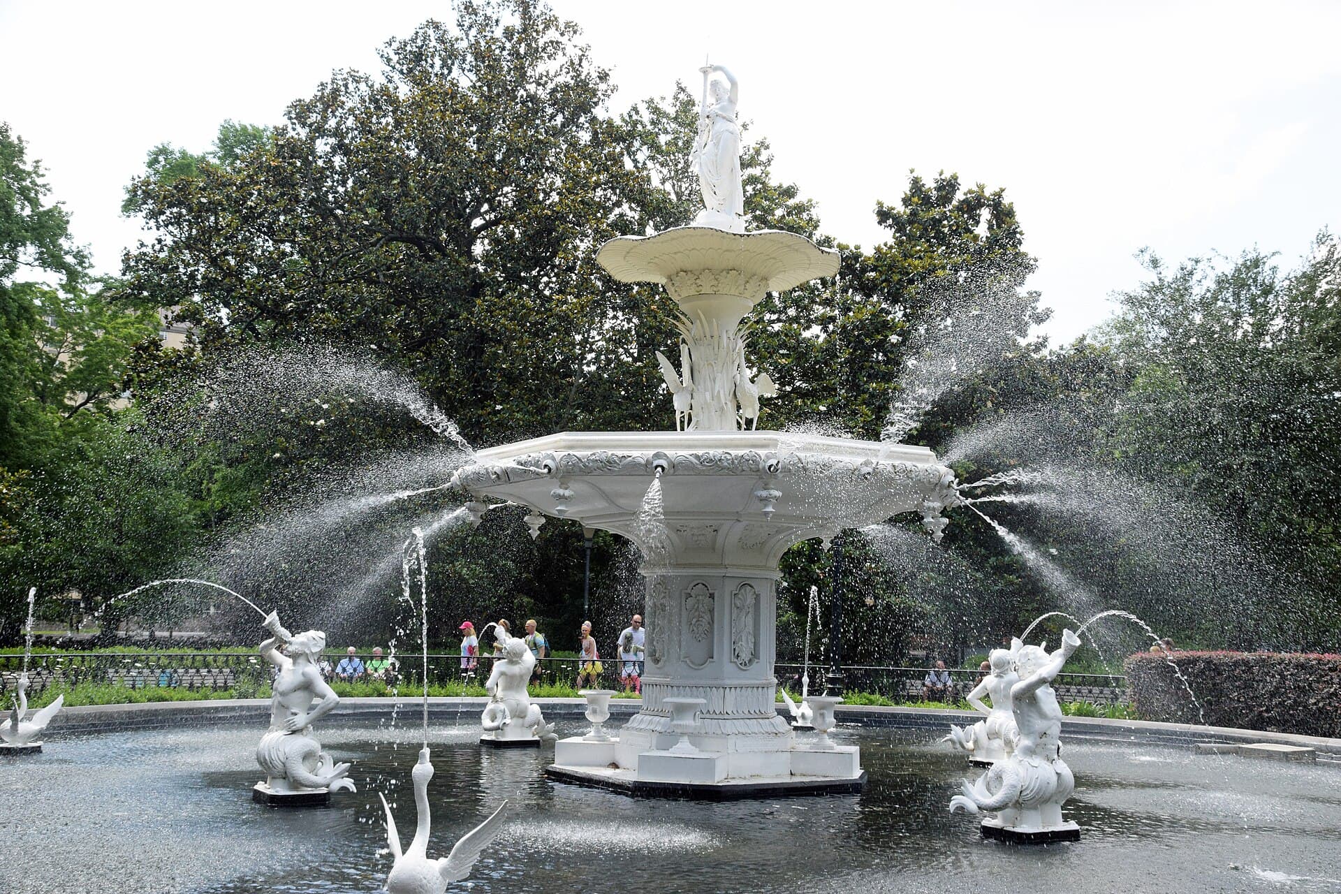 Forsyth Park fountain in full spray beneath live oaks